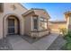 Front entry with bay window and a walkway at 16935 W Villagio Dr, Surprise, AZ 85387