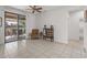 Living area with patio access, comfy seating, and a tiled floor at 16935 W Villagio Dr, Surprise, AZ 85387