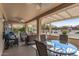 Relaxing covered patio with seating area and ceiling fans at 16935 W Villagio Dr, Surprise, AZ 85387