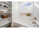 Charming bathroom with a bathtub and open shelving at 1744 W Encinas St, Gilbert, AZ 85233