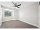 Spacious bedroom with plush carpeting and a ceiling fan at 1744 W Encinas St, Gilbert, AZ 85233