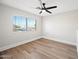 Bright bedroom with hardwood floors and a large window at 1744 W Encinas St, Gilbert, AZ 85233