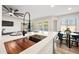 Kitchen with modern sink, faucet, and breakfast bar at 1744 W Encinas St, Gilbert, AZ 85233