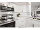 Modern kitchen with stainless steel appliances and white cabinetry at 1744 W Encinas St, Gilbert, AZ 85233