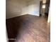 Living room with wood-look flooring and neutral walls at 18202 N Cave Creek Rd # 108, Phoenix, AZ 85032