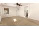 Bright bedroom with carpeting, ceiling fan and en-suite bathroom at 18970 N Alicante St, Maricopa, AZ 85138