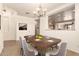 Elegant dining room with a chandelier and hardwood floors at 18970 N Alicante St, Maricopa, AZ 85138