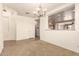 Bright dining room with chandelier and access to kitchen at 18970 N Alicante St, Maricopa, AZ 85138