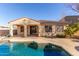 Home exterior view showcasing a pool and patio at 18970 N Alicante St, Maricopa, AZ 85138