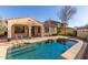 Home exterior view showcasing a pool and patio at 18970 N Alicante St, Maricopa, AZ 85138