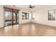 Gathering room with sliding doors to backyard and pool access at 18970 N Alicante St, Maricopa, AZ 85138