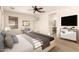 Relaxing main bedroom with a ceiling fan and ensuite bathroom at 18970 N Alicante St, Maricopa, AZ 85138