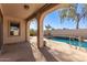 Inviting pool area with a patio and lush landscaping at 18970 N Alicante St, Maricopa, AZ 85138