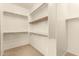 Large walk-in closet with ample shelving and hanging space at 18970 N Alicante St, Maricopa, AZ 85138