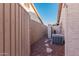 Landscaped backyard with AC unit and stone path at 19662 N 93Rd Dr, Peoria, AZ 85382