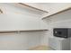 Spacious closet with shelving and a safe at 19662 N 93Rd Dr, Peoria, AZ 85382