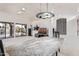 Elegant dining area with a marble table and modern light fixture at 19662 N 93Rd Dr, Peoria, AZ 85382