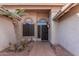 Front entry with tile flooring and desert landscaping at 19662 N 93Rd Dr, Peoria, AZ 85382