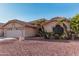 Single-story home with a two-car garage and desert landscaping at 19662 N 93Rd Dr, Peoria, AZ 85382