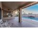 Covered patio with seating area overlooking the pool at 19662 N 93Rd Dr, Peoria, AZ 85382