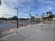 Well maintained pickleball courts with shaded seating areas at 19662 N 93Rd Dr, Peoria, AZ 85382