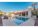 Inviting rectangular pool with a rock waterfall feature at 19662 N 93Rd Dr, Peoria, AZ 85382