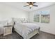 Bright bedroom with double bed and ceiling fan at 19777 N 76Th St # 2263, Scottsdale, AZ 85255