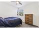 Bright bedroom with a double bed, dresser, and window at 19777 N 76Th St # 2263, Scottsdale, AZ 85255