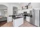 Modern kitchen with white cabinets, stainless steel appliances, and an island at 20234 N 71St Ln, Glendale, AZ 85308