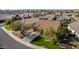 Aerial view of a house showcasing its front yard, driveway, and neighborhood context at 20838 N 101St Dr, Peoria, AZ 85382