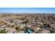 Aerial view of neighborhood with many homes and solar panels at 20838 N 101St Dr, Peoria, AZ 85382