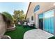 Landscaped backyard with artificial turf and seating at 20838 N 101St Dr, Peoria, AZ 85382