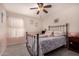 Bedroom with full-size bed and metal frame at 20838 N 101St Dr, Peoria, AZ 85382