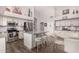 Spacious kitchen featuring modern appliances and white cabinetry at 20838 N 101St Dr, Peoria, AZ 85382