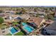 Aerial view of a house with a large, freeform pool and expansive backyard at 20838 N 101St Dr, Peoria, AZ 85382