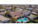 Aerial view of a home with a large pool and a well-maintained backyard at 20838 N 101St Dr, Peoria, AZ 85382