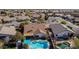 Aerial view highlighting a beautiful pool and backyard, surrounded by neighboring homes at 20838 N 101St Dr, Peoria, AZ 85382