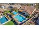 Aerial view showcasing a stunning pool, extensive patio, and a secondary pool at 20838 N 101St Dr, Peoria, AZ 85382