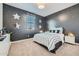 Charming bedroom featuring a star-themed wall and a cozy striped bedding set at 20886 S 231St St, Queen Creek, AZ 85142