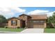 Attractive single-story home with a two-car garage and landscaping at 20886 S 231St St, Queen Creek, AZ 85142