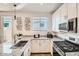 Modern kitchen with granite countertops and stainless steel appliances at 20886 S 231St St, Queen Creek, AZ 85142