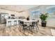 Modern kitchen with white shaker cabinets, stainless steel appliances, and a kitchen island at 20886 S 231St St, Queen Creek, AZ 85142