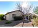 View of backyard, showing home's exterior and landscaping at 21816 N 261St Ave, Buckeye, AZ 85396