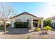 Single story home with covered patio and desert landscaping at 21816 N 261St Ave, Buckeye, AZ 85396