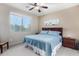 Bright bedroom with a king-size bed and ensuite bathroom at 21816 N 261St Ave, Buckeye, AZ 85396