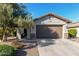 Single-story home with a two-car garage and desert landscaping at 21816 N 261St Ave, Buckeye, AZ 85396