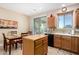 Kitchen with light wood cabinets and a kitchen island at 21816 N 261St Ave, Buckeye, AZ 85396