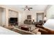 Cozy living room featuring a stone accent wall and comfortable seating at 21816 N 261St Ave, Buckeye, AZ 85396