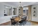 Elegant dining room features a wood table and neutral color palette at 22085 E Rosa Rd, Queen Creek, AZ 85142