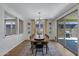 Spacious dining area with large windows and modern light fixture at 22085 E Rosa Rd, Queen Creek, AZ 85142